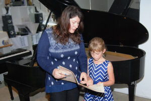 Rosie Mace With Piano Student