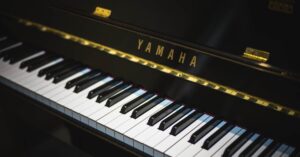 Close-up of a Yamaha piano showing black and white keys, perfect for music enthusiasts.